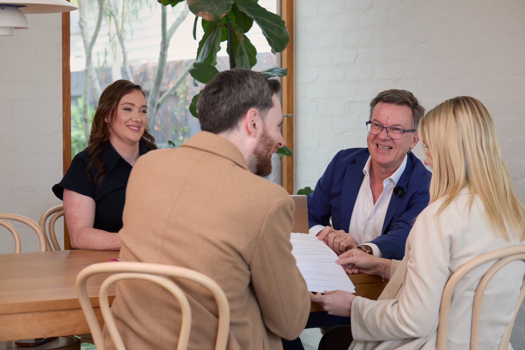 Signing a rental agreement across a table