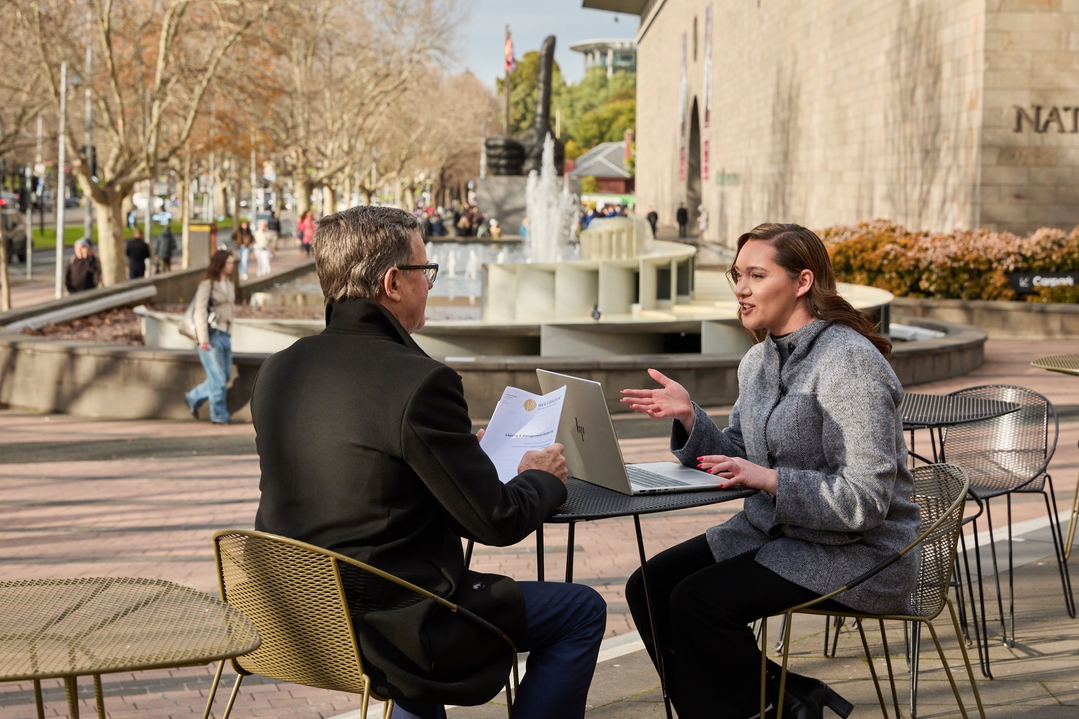 Wolfbrook property manager explaining documents to a tenant